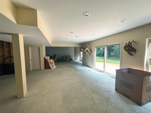 5580 Birch Ln, Davisburg, MI 48350 - unfurnished living room with concrete flooring and recessed lighting