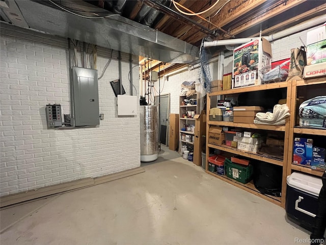 5580 Birch Ln, Davisburg, MI 48350 - unfinished below grade area featuring electric panel, brick wall, and gas water heater