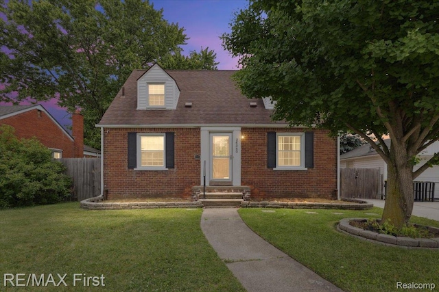 24360 Grove Ave, Eastpointe, MI 48021 - cape cod-style house featuring brick siding and a shingled roof