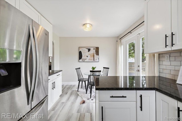 24360 Grove Ave, Eastpointe, MI 48021 - kitchen featuring stainless steel refrigerator with ice dispenser, a peninsula, white cabinetry, and light wood finished floors