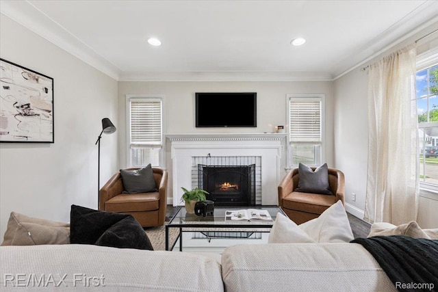 24360 Grove Ave, Eastpointe, MI 48021 - living area with ornamental molding, a fireplace, wood finished floors, and recessed lighting