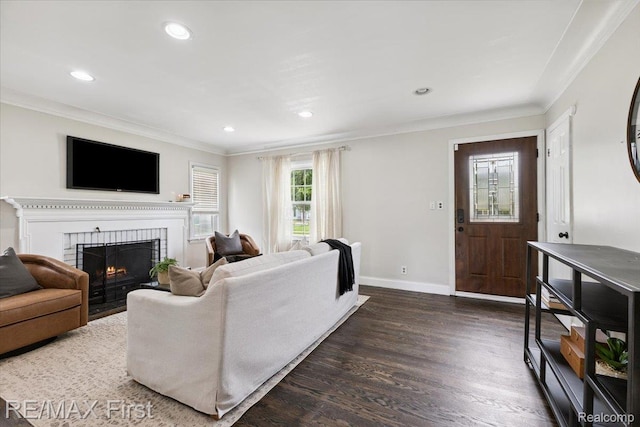 24360 Grove Ave, Eastpointe, MI 48021 - living room featuring crown molding, dark wood-style flooring, a brick fireplace, and recessed lighting
