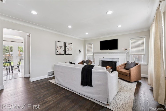 24360 Grove Ave, Eastpointe, MI 48021 - living room featuring dark wood-type flooring, ornamental molding, a brick fireplace, and recessed lighting