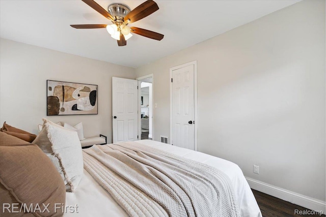 24360 Grove Ave, Eastpointe, MI 48021 - bedroom with dark wood-style floors and ceiling fan