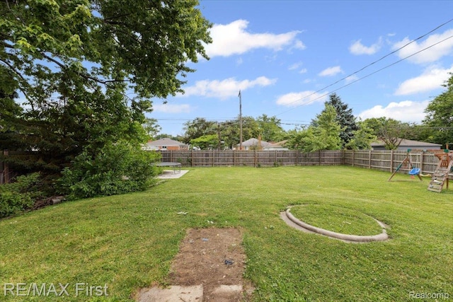 24360 Grove Ave, Eastpointe, MI 48021 - fenced backyard featuring a playground