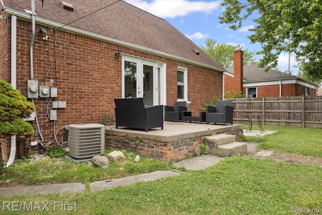 24360 Grove Ave, Eastpointe, MI 48021 - rear view of property with brick siding, a shingled roof, french doors, and a patio area