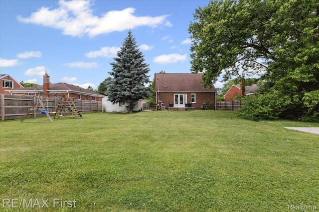 24360 Grove Ave, Eastpointe, MI 48021 - fenced backyard featuring a playground