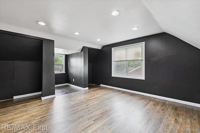 24360 Grove Ave, Eastpointe, MI 48021 - unfurnished bedroom with lofted ceiling, wood finished floors, and recessed lighting