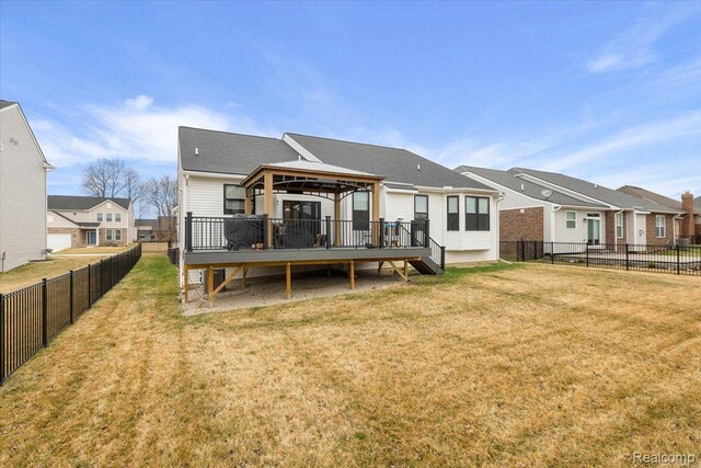 20848 Wexford Dr, Macomb, MI 48044 - rear view of house with a gazebo, a wooden deck, a fenced backyard, and a residential view