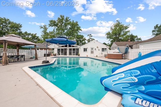 187 Gateway Dr, Waterford, MI 48328 - view of swimming pool featuring a patio area, a fenced backyard, a water slide, a gazebo, and a hot tub