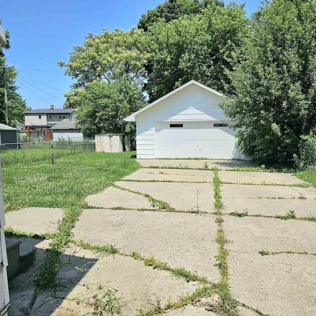 1418 Birney St, Saginaw, MI 48602 - view of yard with an outbuilding and a garage