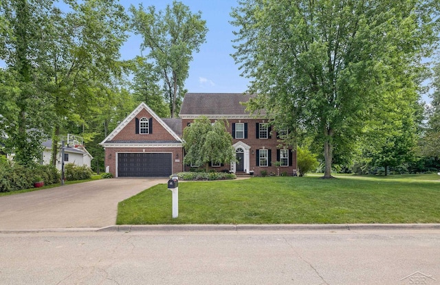 12449 Northway Pkwy, Freeland, MI 48623 - colonial inspired home with a garage, brick siding, a front lawn, and driveway