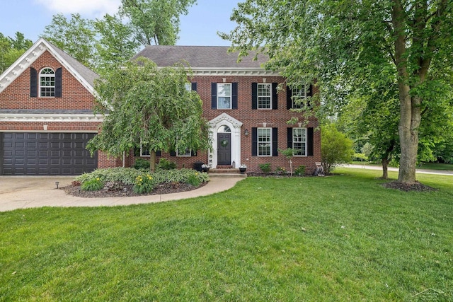 12449 Northway Pkwy, Freeland, MI 48623 - colonial home with concrete driveway, brick siding, a front yard, and an attached garage