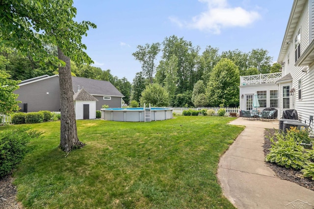 12449 Northway Pkwy, Freeland, MI 48623 - view of yard featuring an outdoor pool and a patio