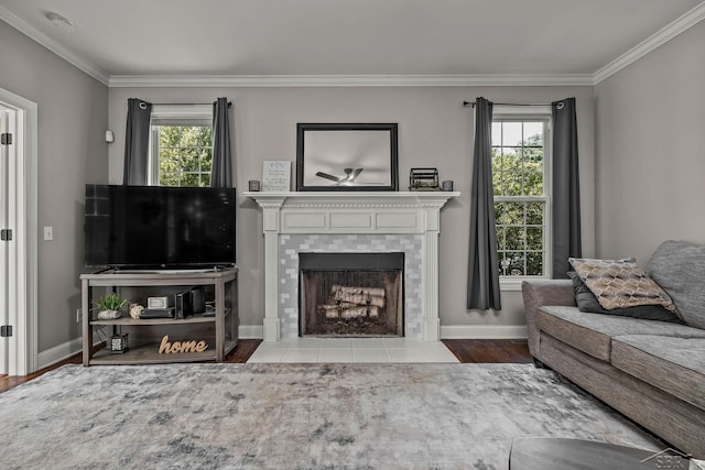 12449 Northway Pkwy, Freeland, MI 48623 - living room featuring crown molding, a tiled fireplace, and wood finished floors