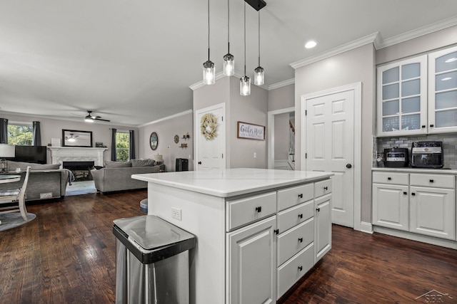 12449 Northway Pkwy, Freeland, MI 48623 - kitchen featuring a ceiling fan, white cabinets, crown molding, a kitchen island, and light countertops