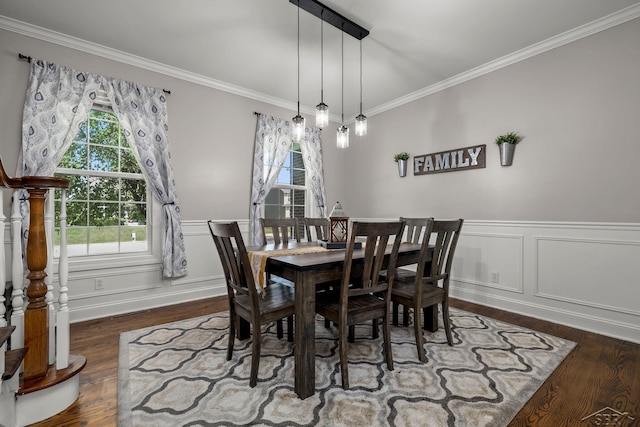 12449 Northway Pkwy, Freeland, MI 48623 - dining room featuring wood finished floors, ornamental molding, a wainscoted wall, and a decorative wall