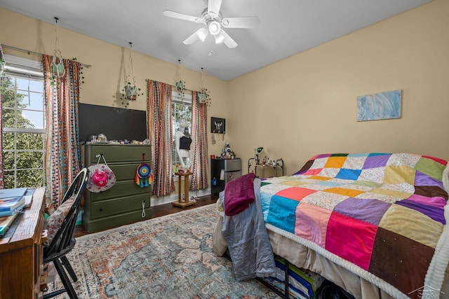12449 Northway Pkwy, Freeland, MI 48623 - bedroom featuring multiple windows, wood finished floors, and ceiling fan