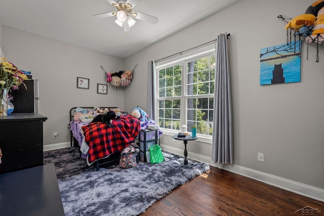 12449 Northway Pkwy, Freeland, MI 48623 - bedroom with freestanding refrigerator, wood finished floors, and a ceiling fan