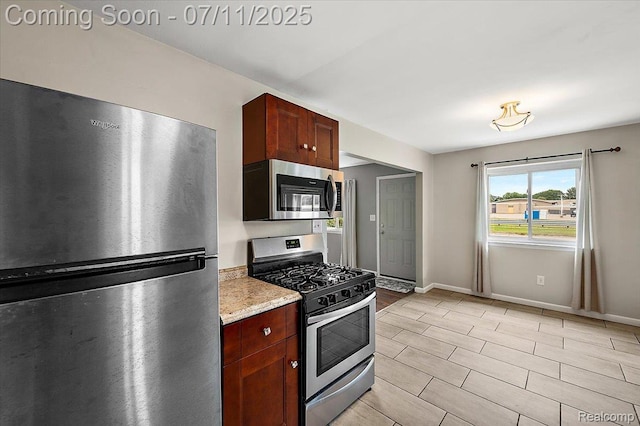 27043 Lorenz St, Madison Heights, MI 48071 - kitchen with appliances with stainless steel finishes and light stone countertops