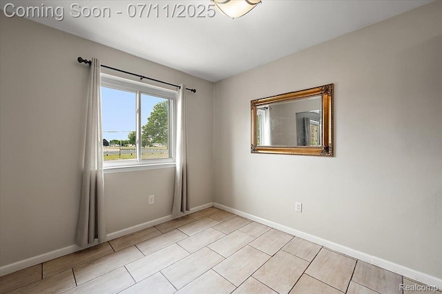 27043 Lorenz St, Madison Heights, MI 48071 - spare room with baseboards and light tile patterned flooring