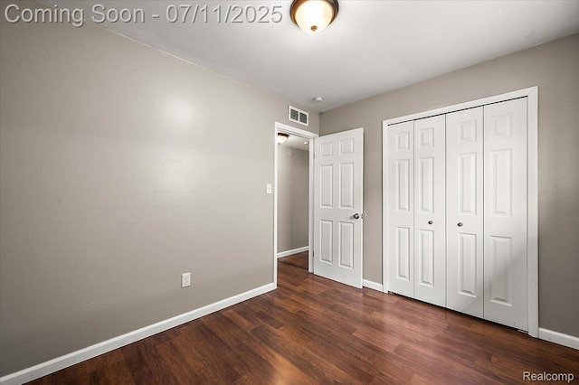 27043 Lorenz St, Madison Heights, MI 48071 - unfurnished bedroom with dark wood-style floors and a closet