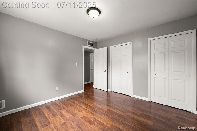 27043 Lorenz St, Madison Heights, MI 48071 - unfurnished bedroom featuring wood finished floors and multiple closets