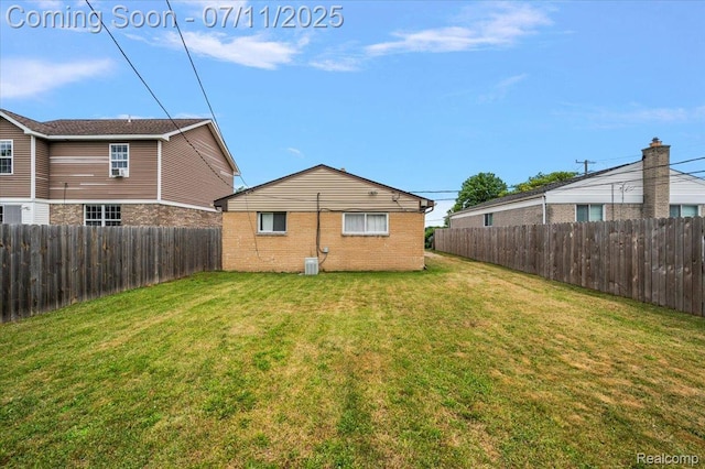 27043 Lorenz St, Madison Heights, MI 48071 - back of property featuring a fenced backyard and brick siding