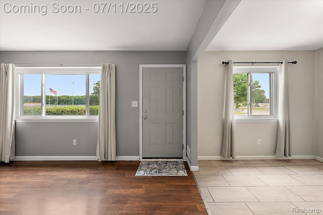 27043 Lorenz St, Madison Heights, MI 48071 - foyer entrance with healthy amount of natural light and wood finished floors