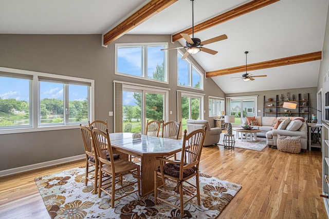 26794 Dutch Settlement St, Dowagiac, MI 49047 - dining space with beamed ceiling, light wood-style flooring, a ceiling fan, and high vaulted ceiling