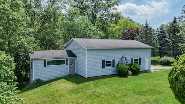 26794 Dutch Settlement St, Dowagiac, MI 49047 - view of side of home with a yard and roof with shingles