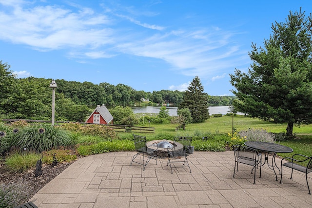 26794 Dutch Settlement St, Dowagiac, MI 49047 - view of patio / terrace featuring a water view and an outdoor fire pit