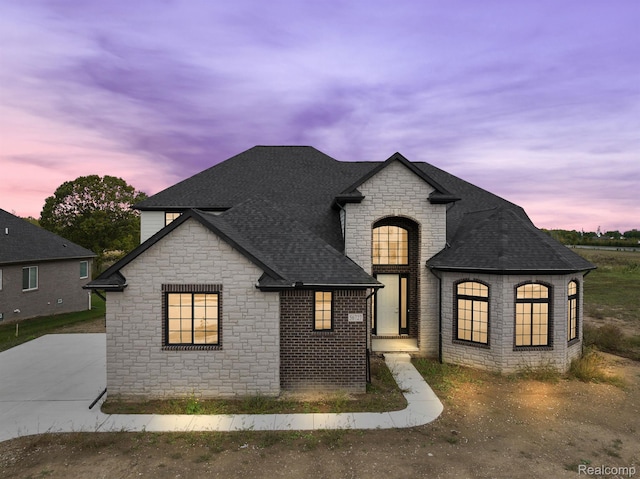 53650 Romeo Plank Rd, Macomb, MI 48042 - french provincial home featuring stone siding and roof with shingles