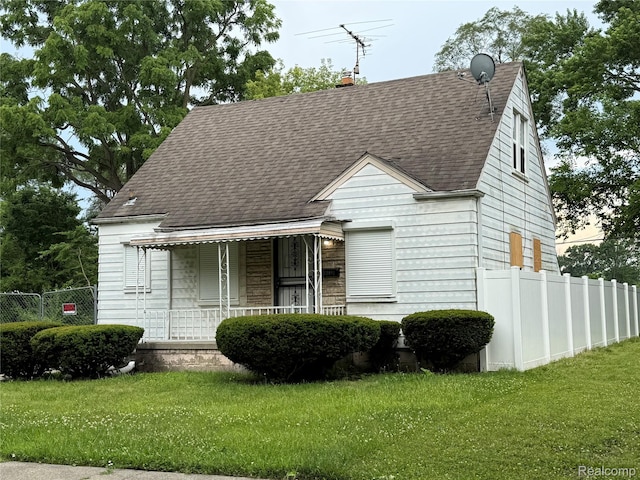 12081 Stout St, Detroit, MI 48228 - view of front facade with a shingled roof and covered porch