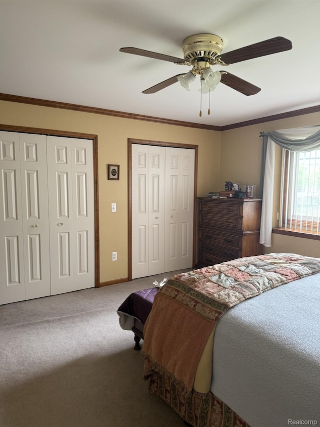 35851 Ireneus Dr, New Baltimore, MI 48047 - bedroom featuring two closets, carpet, crown molding, and a ceiling fan