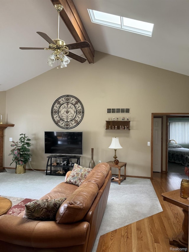 35851 Ireneus Dr, New Baltimore, MI 48047 - living room with a skylight, high vaulted ceiling, a ceiling fan, beam ceiling, and wood finished floors