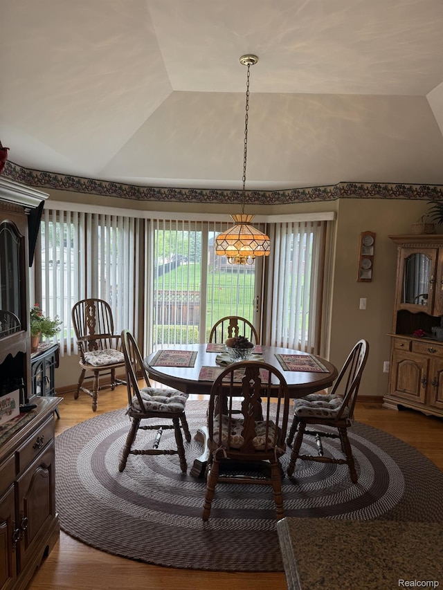 35851 Ireneus Dr, New Baltimore, MI 48047 - dining area featuring healthy amount of natural light, vaulted ceiling, and light wood-type flooring