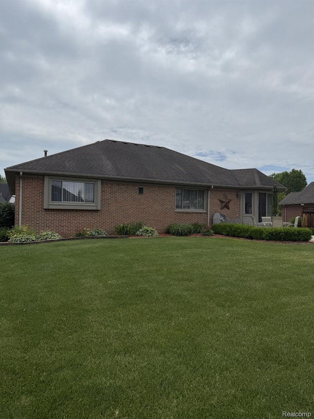 35851 Ireneus Dr, New Baltimore, MI 48047 - view of front of house featuring brick siding and a front lawn