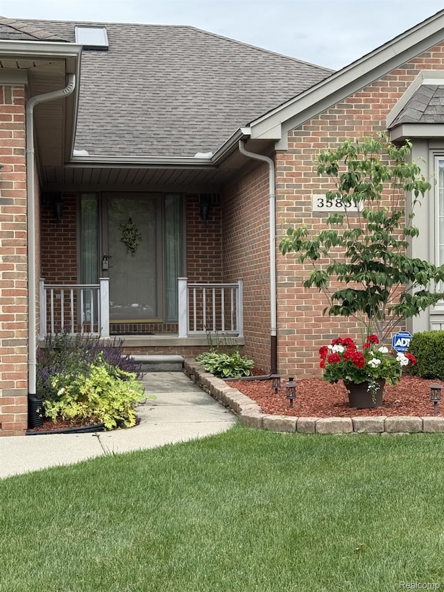 35851 Ireneus Dr, New Baltimore, MI 48047 - entrance to property featuring a shingled roof and brick siding