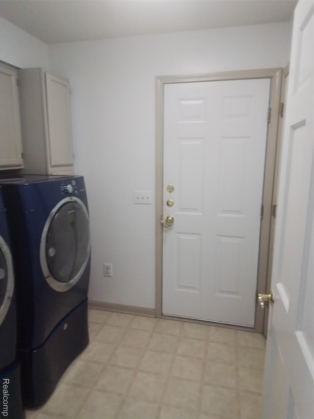 9472 Hill Rd, Swartz Creek, MI 48473 - laundry room featuring cabinet space, independent washer and dryer, and light floors