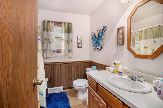 5100 Holton Duck Lake Rd, Twin Lake, MI 49457 - full bath featuring wainscoting, vanity, wooden walls, and wood finished floors