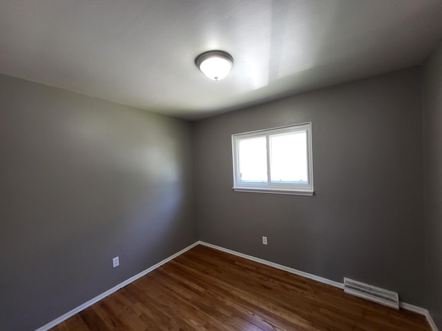 6163 Glenis St, Taylor, MI 48180 - spare room with baseboards and dark wood finished floors