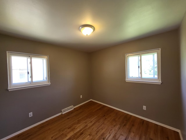 6163 Glenis St, Taylor, MI 48180 - spare room featuring plenty of natural light and dark wood-type flooring