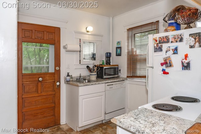 464 E Cambourne St, Ferndale, MI 48220 - kitchen featuring white appliances, white cabinets, plenty of natural light, light countertops, and ornamental molding