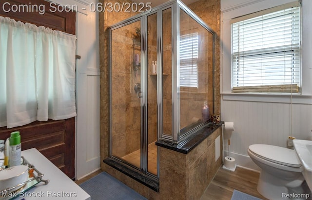 464 E Cambourne St, Ferndale, MI 48220 - bathroom with a stall shower, wood finished floors, and wainscoting