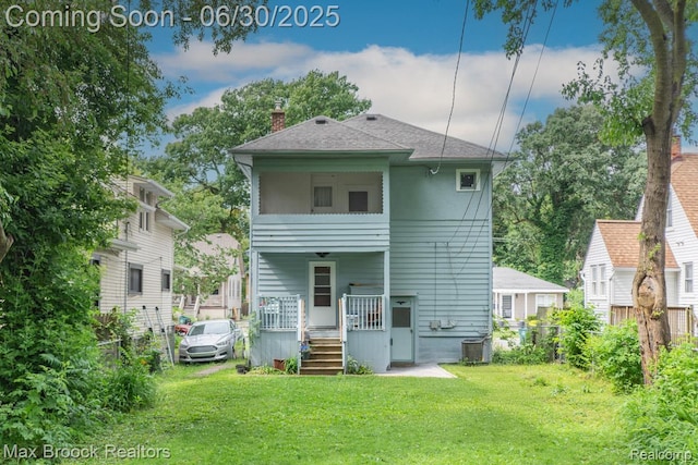 464 E Cambourne St, Ferndale, MI 48220 - rear view of property featuring a chimney, a porch, and a shingled roof