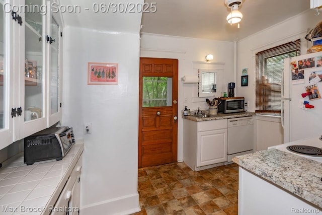 464 E Cambourne St, Ferndale, MI 48220 - kitchen with white appliances, tile counters, white cabinetry, and stone finish floors