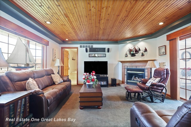 2165 Augsburg Dr, Saginaw, MI 48603 - living room with carpet floors, plenty of natural light, wooden ceiling, a brick fireplace, and recessed lighting