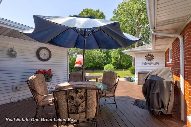 2165 Augsburg Dr, Saginaw, MI 48603 - wooden deck featuring outdoor dining area and grilling area