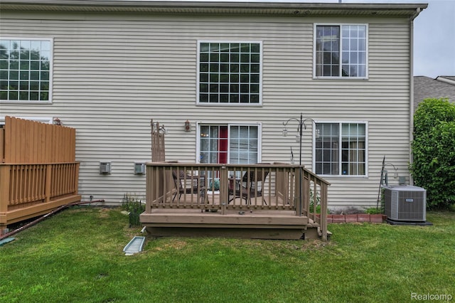 2255 Crystal Crossing Dr, Howell, MI 48843 - back of property featuring a deck and a lawn